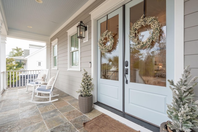 doorway to property with a porch