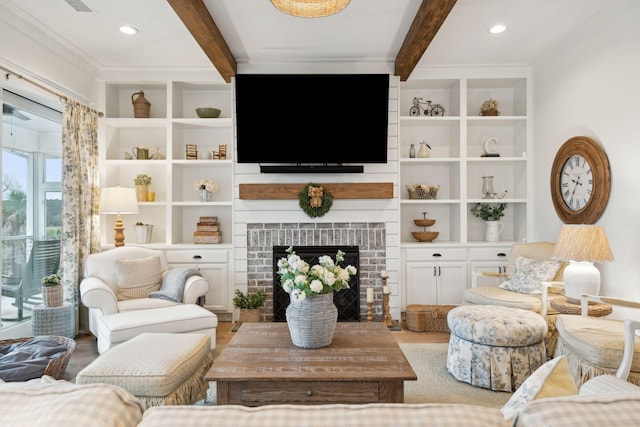 living room with wood-type flooring, a brick fireplace, beam ceiling, and built in shelves