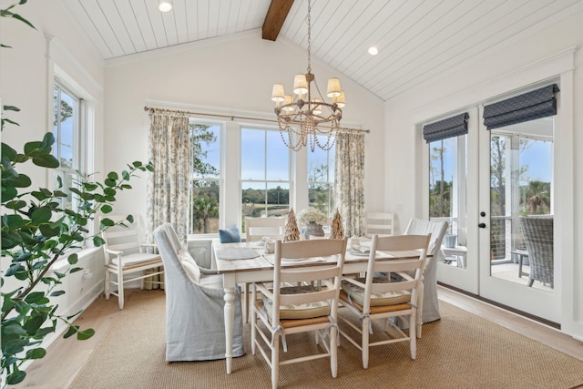 dining room featuring wood ceiling, light hardwood / wood-style flooring, an inviting chandelier, vaulted ceiling with beams, and french doors