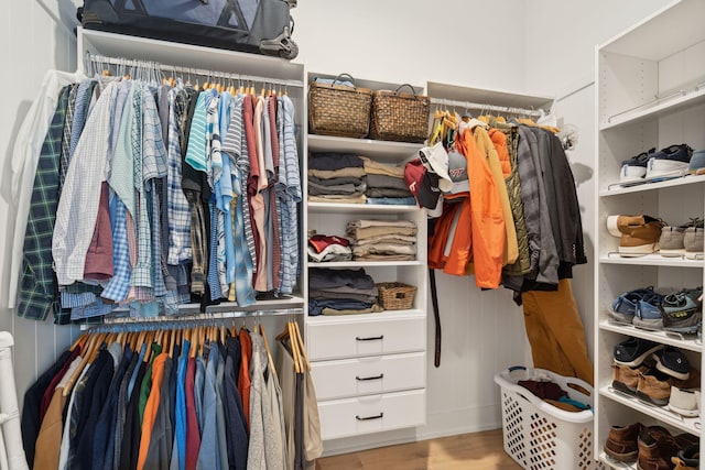 spacious closet with light hardwood / wood-style floors