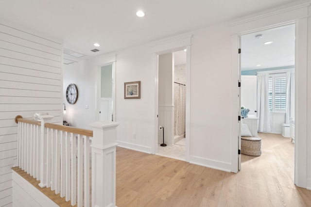 hall with light hardwood / wood-style flooring