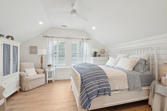 bedroom with vaulted ceiling, ceiling fan, and light hardwood / wood-style flooring