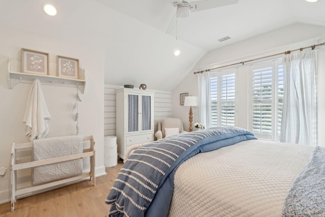 bedroom with vaulted ceiling, light hardwood / wood-style floors, and ceiling fan