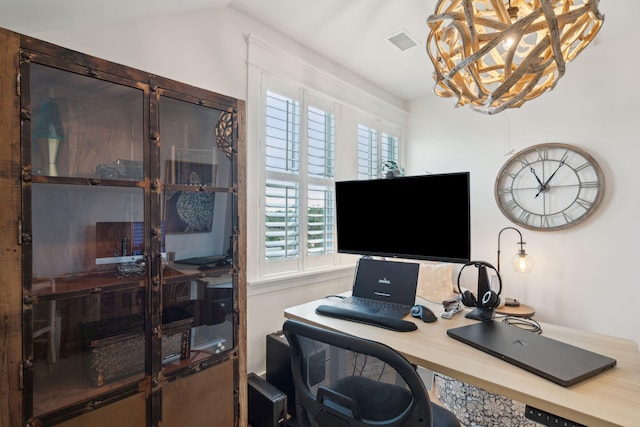 office space featuring a notable chandelier