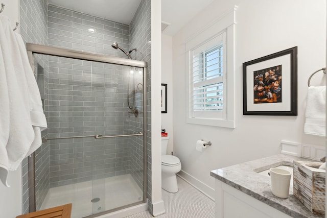 bathroom with tile patterned flooring, toilet, and walk in shower