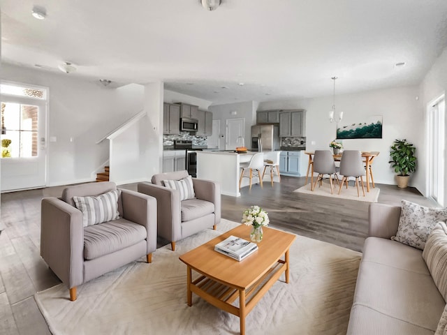 living room with a healthy amount of sunlight and light hardwood / wood-style floors