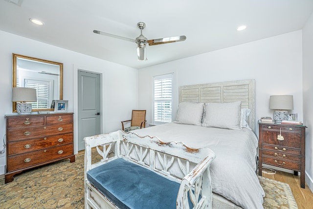 bedroom featuring ceiling fan and light hardwood / wood-style flooring