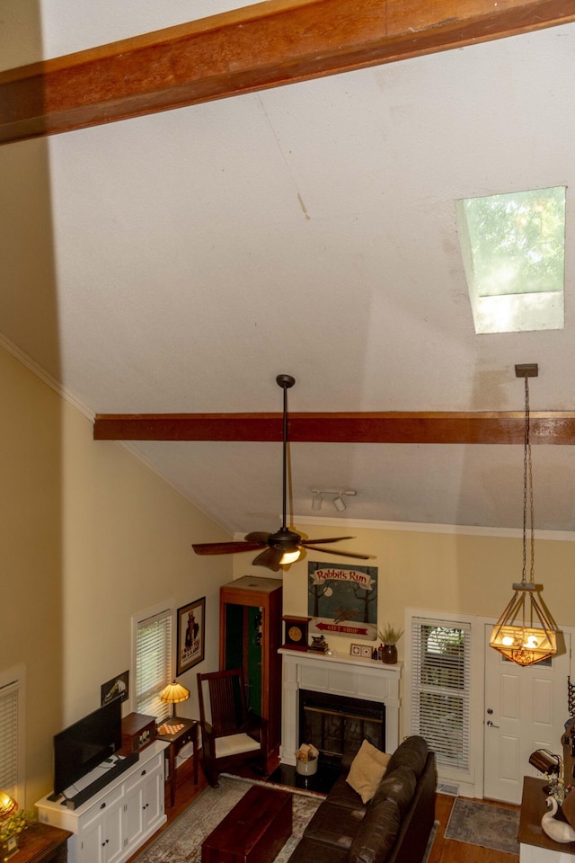 152 Mansfield Blvd, Charleston, SC 29418 - living area featuring a ceiling fan, a glass covered fireplace, beamed ceiling, high vaulted ceiling, and ornamental molding