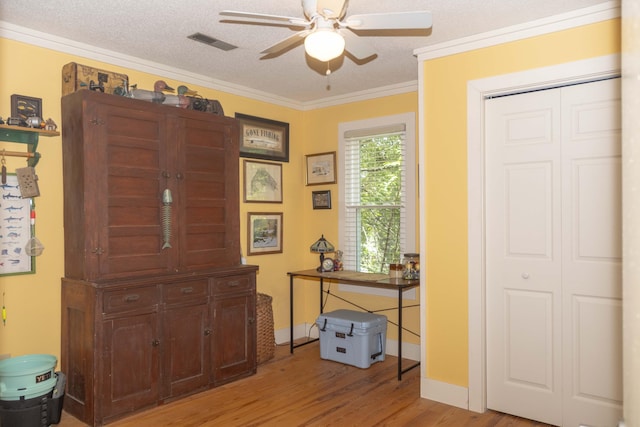 152 Mansfield Blvd, Charleston, SC 29418 - entryway featuring light wood-style flooring, a ceiling fan, crown molding, baseboards, and a textured ceiling