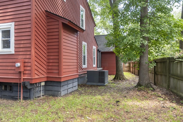 152 Mansfield Blvd, Charleston, SC 29418 - view of side of home with cooling unit and roof with shingles