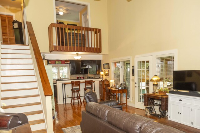 152 Mansfield Blvd, Charleston, SC 29418 - living room with dark wood-style floors, stairs, ceiling fan, and a high ceiling