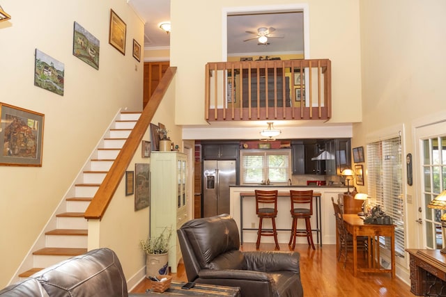 152 Mansfield Blvd, Charleston, SC 29418 - living room with a high ceiling, stairs, wood finished floors, and ceiling fan