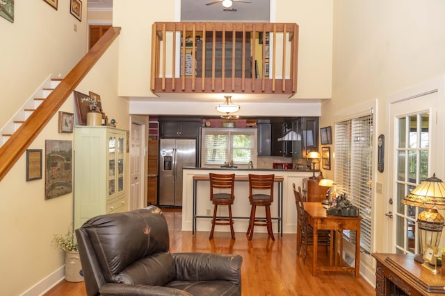 152 Mansfield Blvd, Charleston, SC 29418 - living room with a high ceiling, wood finished floors, ceiling fan, and stairs