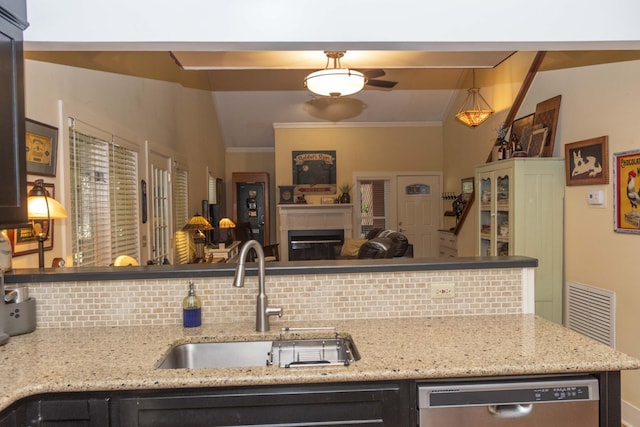 152 Mansfield Blvd, Charleston, SC 29418 - kitchen with a sink, stainless steel dishwasher, tasteful backsplash, vaulted ceiling, and ornamental molding