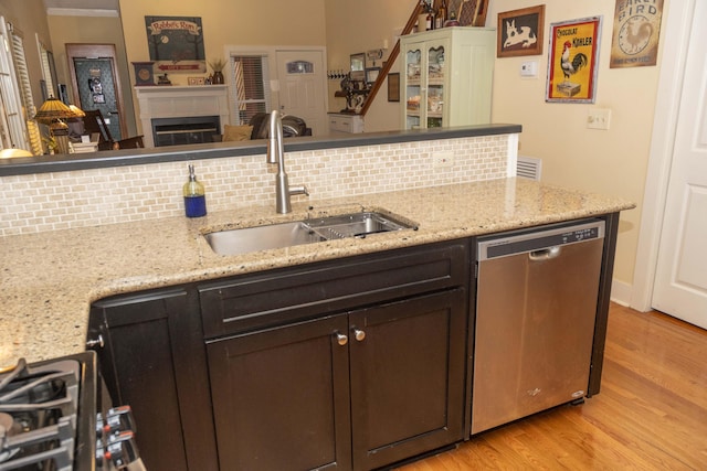 152 Mansfield Blvd, Charleston, SC 29418 - kitchen featuring dishwasher, a sink, tasteful backsplash, and light wood-style floors