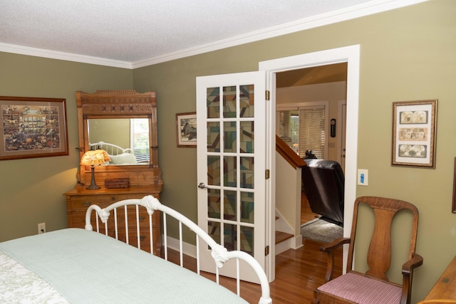 152 Mansfield Blvd, Charleston, SC 29418 - bedroom with wood finished floors, crown molding, and a textured ceiling