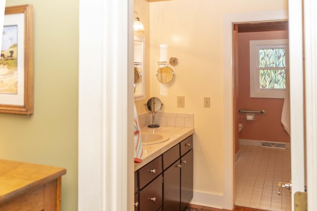 152 Mansfield Blvd, Charleston, SC 29418 - bathroom with vanity, toilet, tile patterned floors, and baseboards