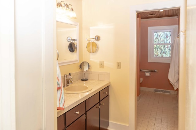 152 Mansfield Blvd, Charleston, SC 29418 - bathroom featuring vanity, baseboards, tile patterned floors, and toilet