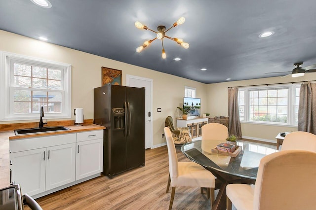 dining space featuring baseboards, recessed lighting, a ceiling fan, and light wood-style floors