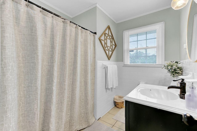 full bathroom featuring crown molding, tile walls, wainscoting, tile patterned floors, and vanity