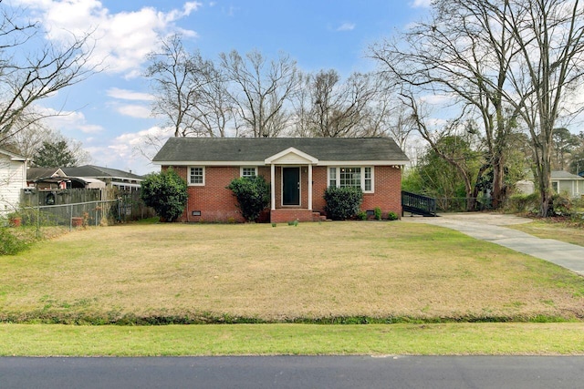 view of front of property featuring brick siding, a front lawn, fence, concrete driveway, and crawl space