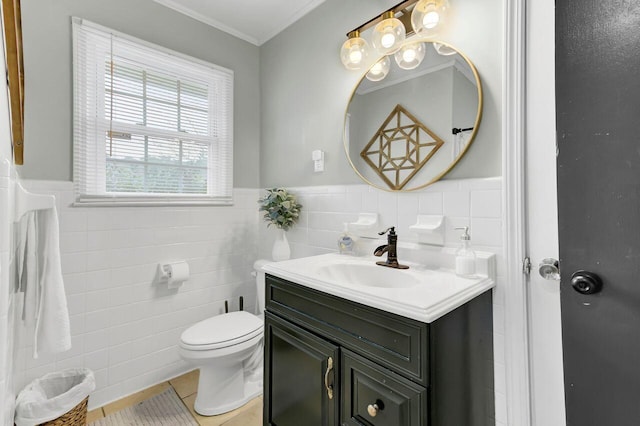 bathroom with tile patterned flooring, toilet, vanity, and tile walls