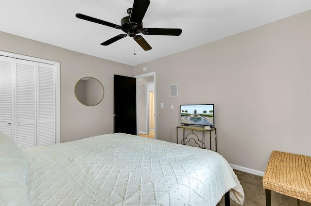 carpeted bedroom with baseboards, visible vents, a closet, and ceiling fan