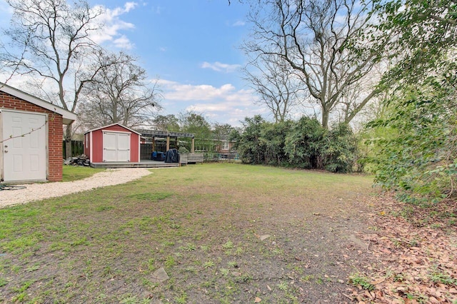 view of yard with a storage unit and an outdoor structure