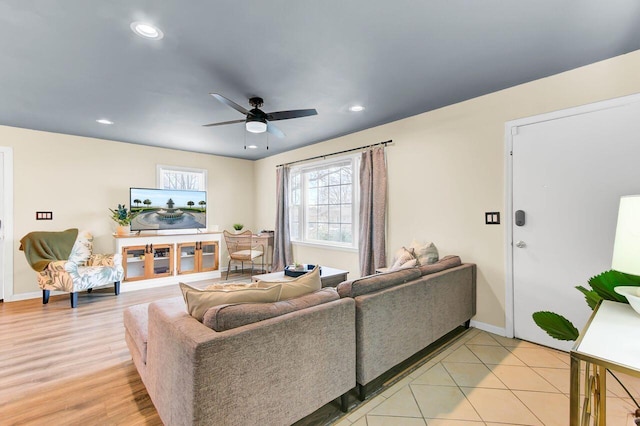 living room with a ceiling fan, recessed lighting, baseboards, and light wood finished floors