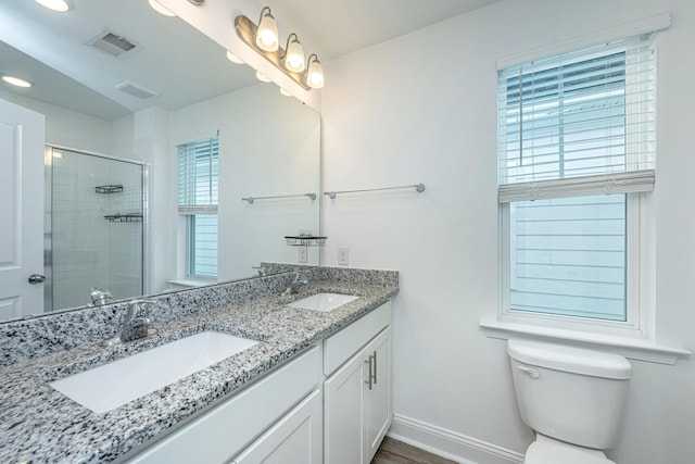 full bath with a stall shower, visible vents, and a sink