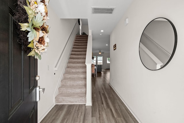 foyer featuring ceiling fan and dark hardwood / wood-style floors