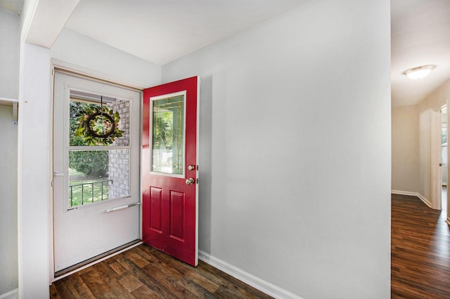 entrance foyer featuring baseboards and dark wood-type flooring
