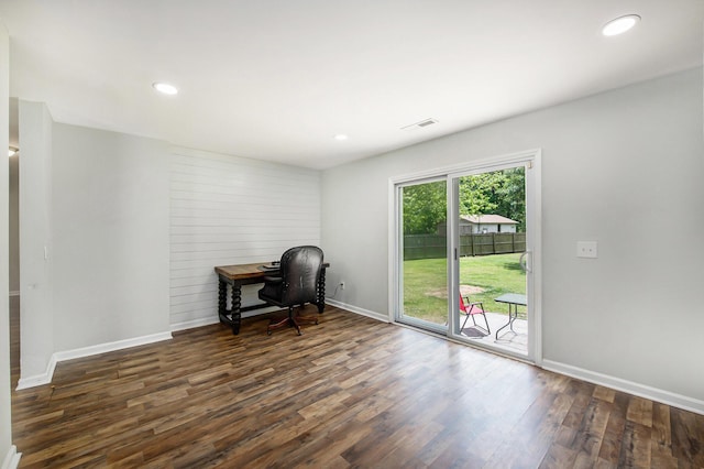 unfurnished office with dark wood-style flooring, baseboards, visible vents, and recessed lighting