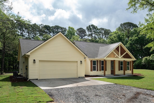 view of front of property with driveway, a garage, cooling unit, a front lawn, and a shingled roof