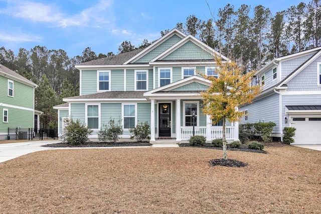 craftsman house with a garage and a porch