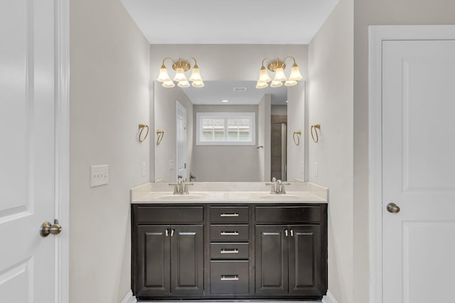 bathroom with vanity and a shower with door