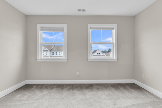 unfurnished room with carpet floors