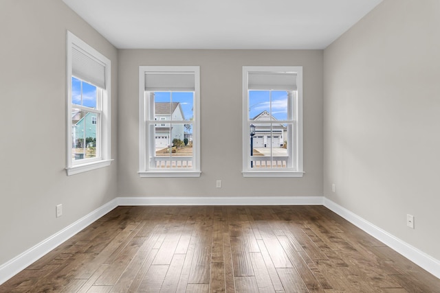 unfurnished room with wood-type flooring