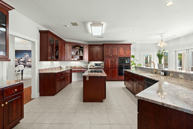 kitchen featuring a center island, sink, hanging light fixtures, light tile patterned floors, and black appliances