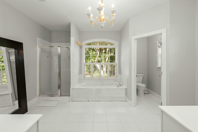 full bathroom featuring a chandelier, tile patterned floors, separate shower and tub, and toilet