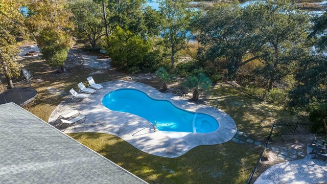 view of pool featuring a patio and a trampoline