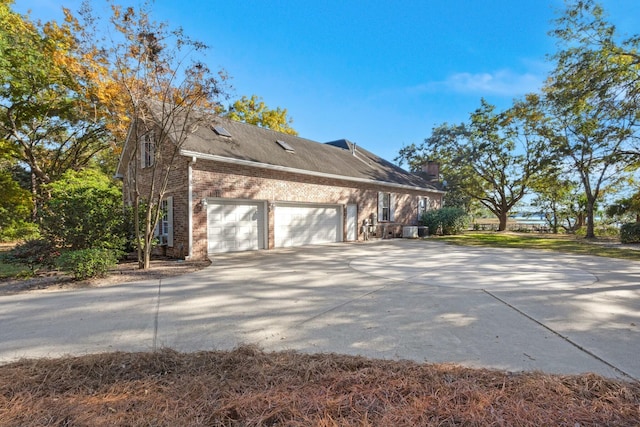 view of side of property with a garage