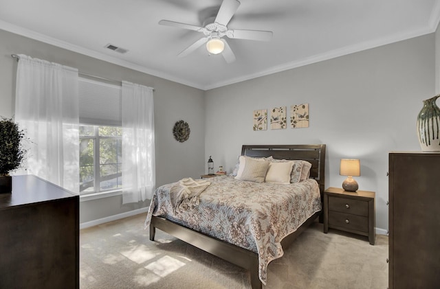 bedroom featuring light carpet, ornamental molding, visible vents, and baseboards