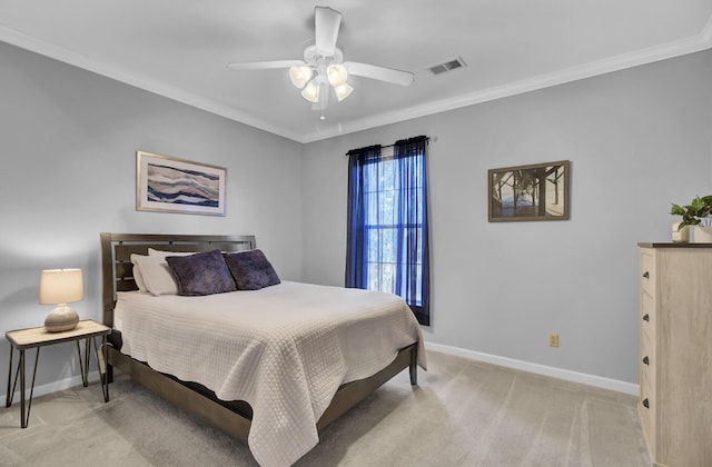 bedroom featuring ceiling fan, light carpet, visible vents, baseboards, and ornamental molding