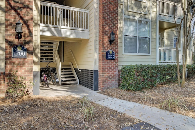 property entrance with brick siding