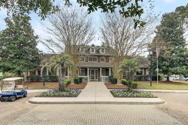 view of front of home featuring french doors and brick siding