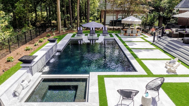 view of pool featuring fence, an in ground hot tub, outdoor lounge area, and a patio area