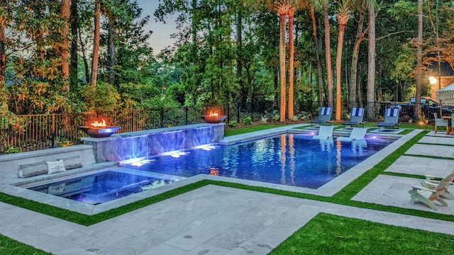 view of pool with a patio area, a fenced in pool, an in ground hot tub, and a fenced backyard