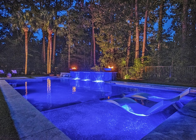 view of swimming pool with a fenced in pool and fence