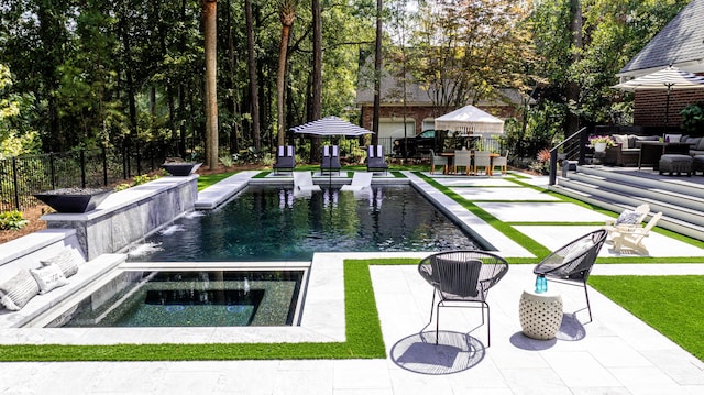 view of pool featuring a patio, a fenced in pool, fence, an in ground hot tub, and outdoor lounge area